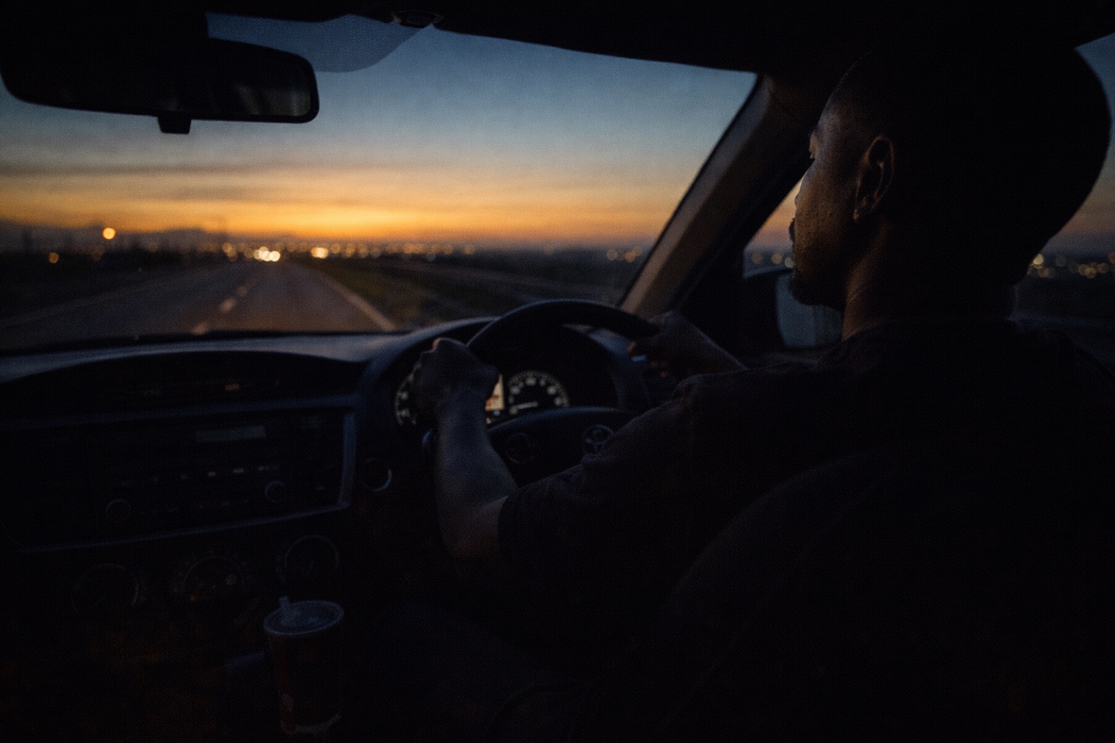 A driver heading into the sunset