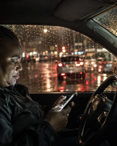 A driver showing the apps he works